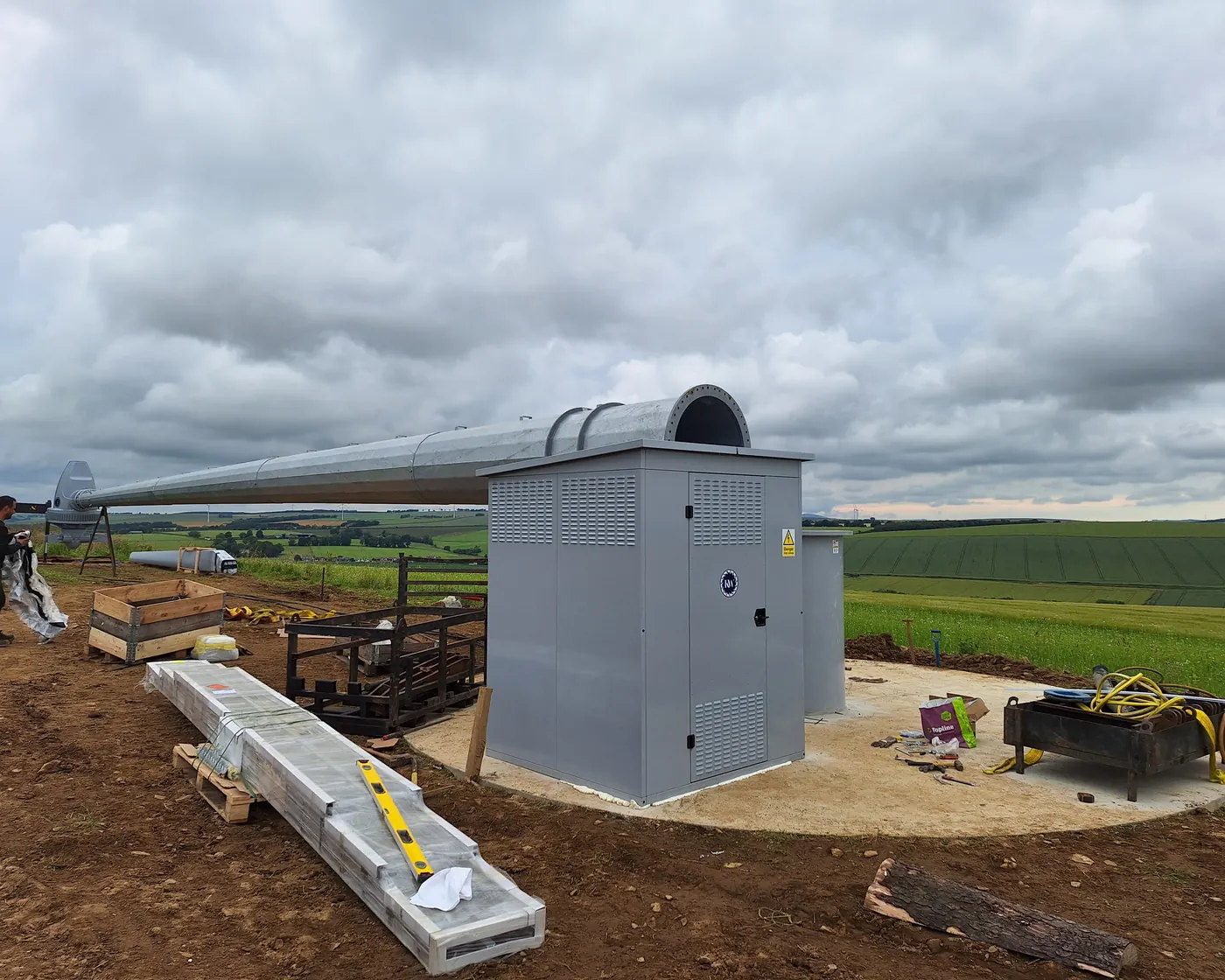 The installation site in Aberdeenshire: the inverter enclosure, tower and open farmland