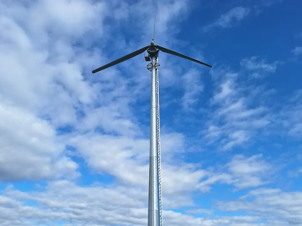 A Kodair wind turbine against a blue sky at a private residence in Ireland