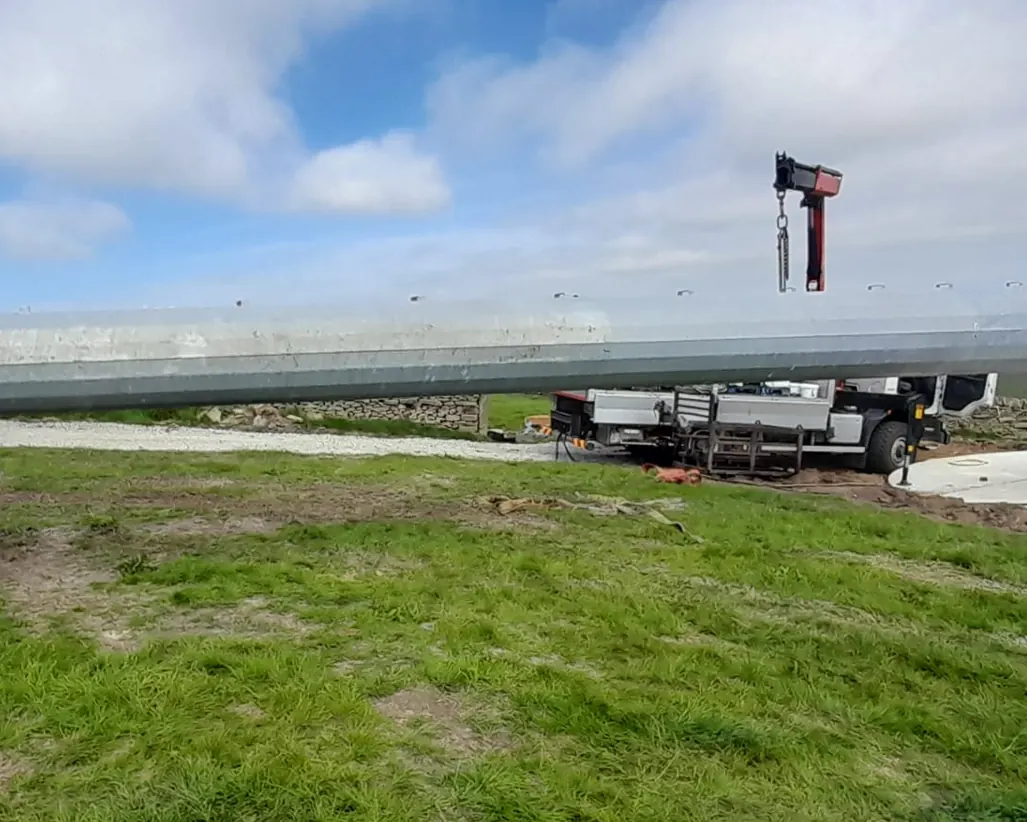 The KW30 tower and nacelle laid out on the farm before raising