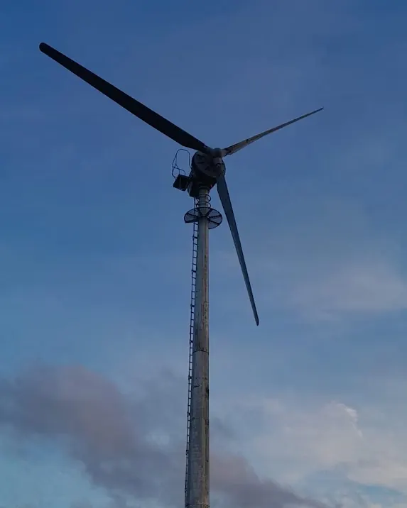 A Kodair KW30 turning against a blue sky on the Yorkshire farm