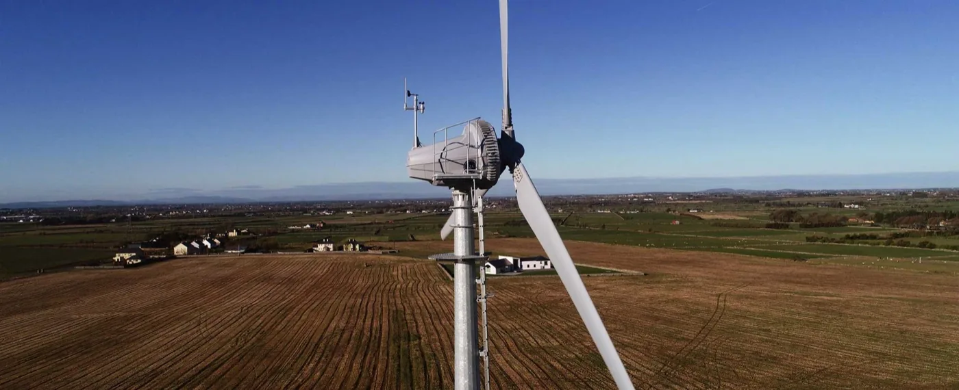 A Kodair turbine above open farmland