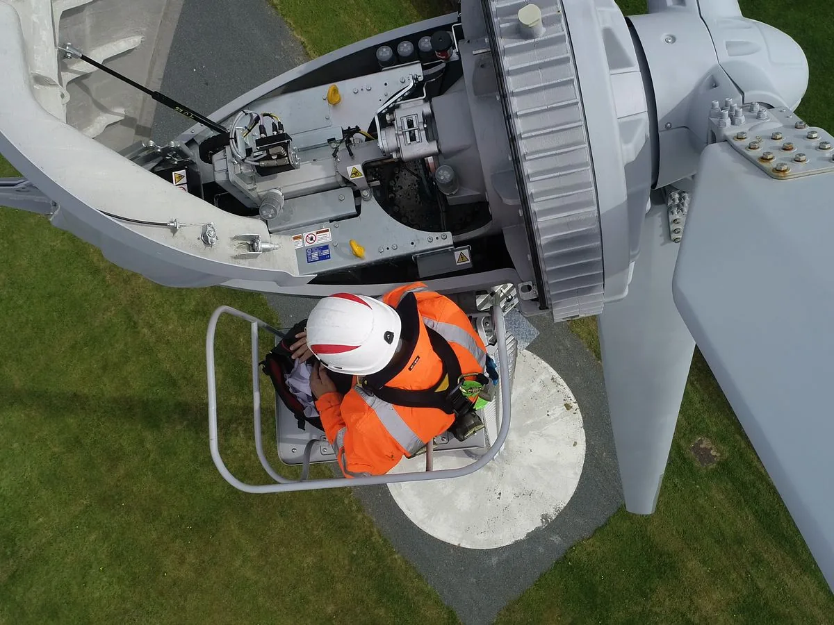 Seen from above: a technician working in the open nacelle