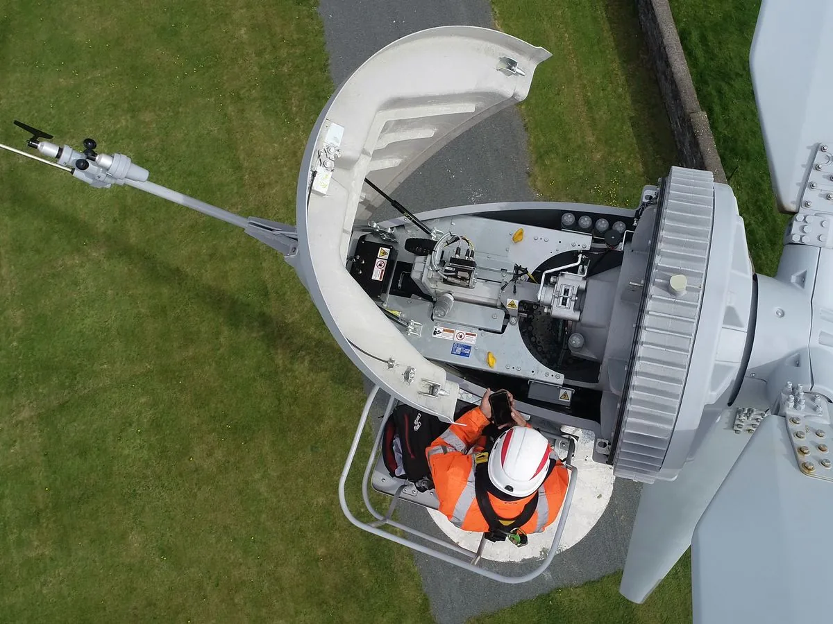 Seen from above: a technician working inside the open nacelle