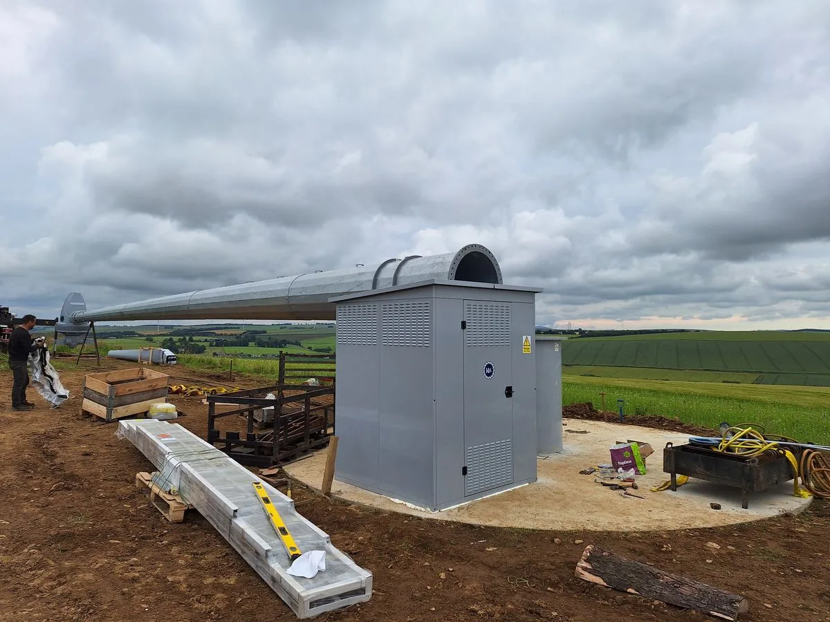 The tower laid out on site beside the inverter hut
