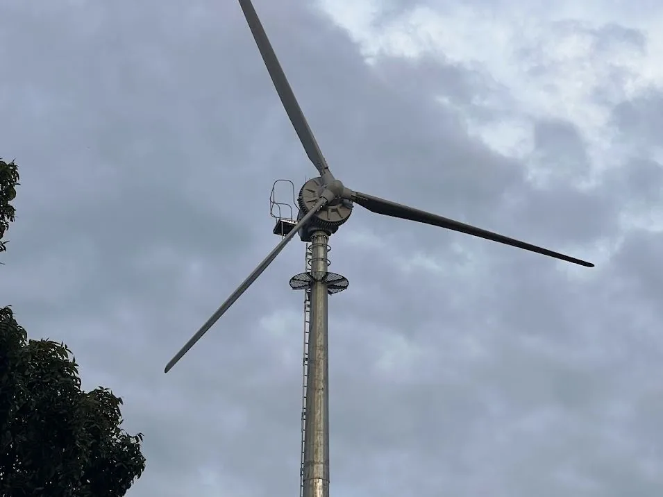 A Kodair turbine against a cloudy sky